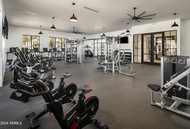 workout area with french doors and ceiling fan