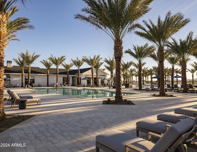 view of home's community with a patio and a pool