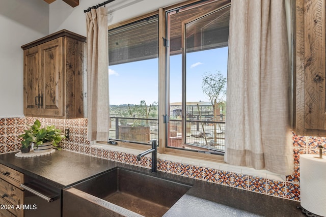 kitchen with decorative backsplash and sink