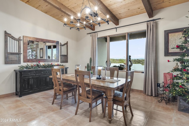 tiled dining room featuring beamed ceiling, wooden ceiling, and a chandelier