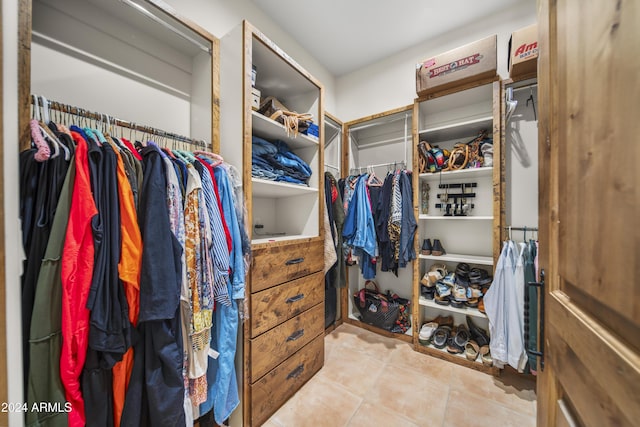 walk in closet featuring light tile patterned floors