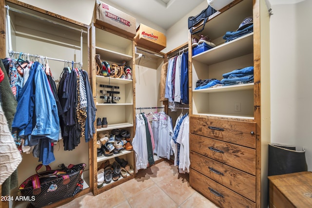 walk in closet featuring tile patterned flooring