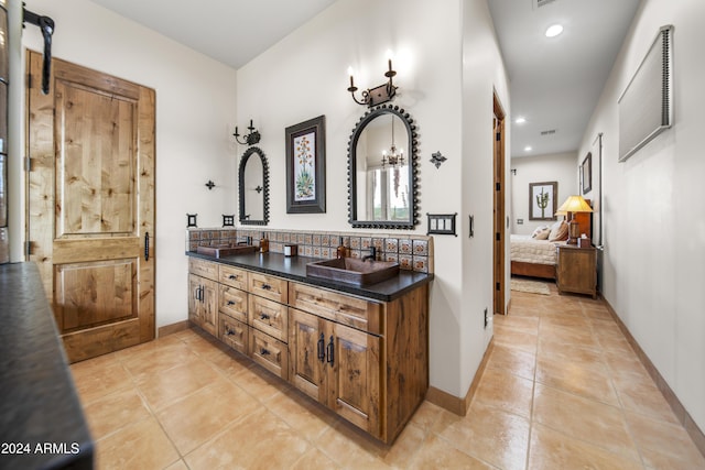 bathroom with tile patterned flooring and vanity