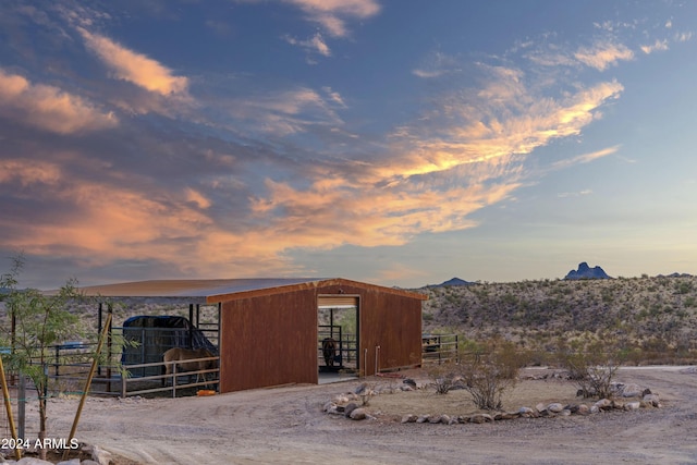 outdoor structure at dusk with a mountain view