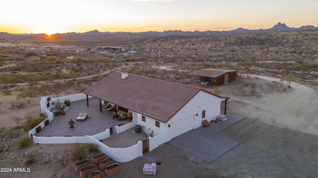 aerial view at dusk with a mountain view