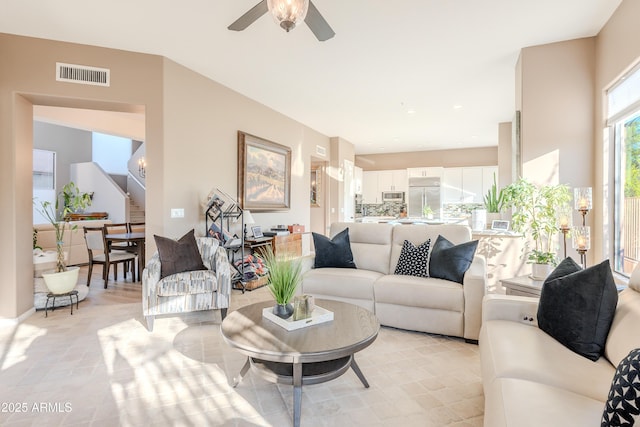 10772 E Running Deer Trl, Scottsdale, AZ 85262 - living room with stairway and a ceiling fan
