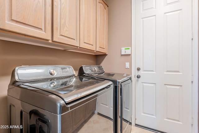 10772 E Running Deer Trl, Scottsdale, AZ 85262 - laundry area featuring independent washer and dryer and cabinet space