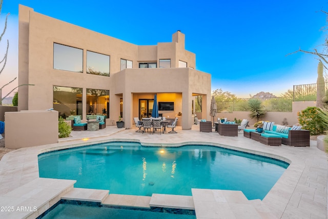 10772 E Running Deer Trl, Scottsdale, AZ 85262 - rear view of house with outdoor lounge area, stucco siding, and a patio