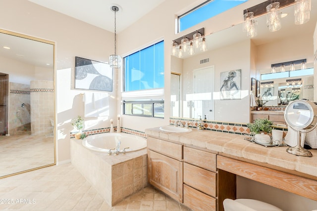 10772 E Running Deer Trl, Scottsdale, AZ 85262 - bathroom with a bath, walk in shower, healthy amount of natural light, and vanity