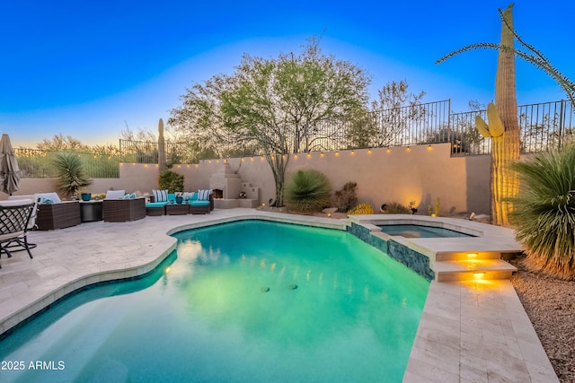 10772 E Running Deer Trl, Scottsdale, AZ 85262 - view of swimming pool featuring outdoor lounge area, a patio, a fenced backyard, and a pool with connected hot tub