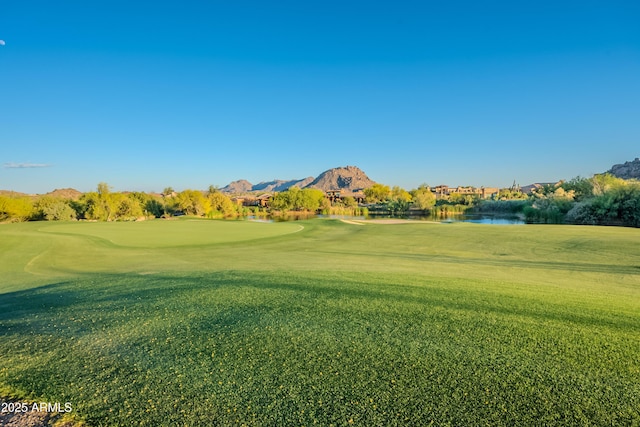 10772 E Running Deer Trl, Scottsdale, AZ 85262 - surrounding community with view of golf course, a water and mountain view, and a yard