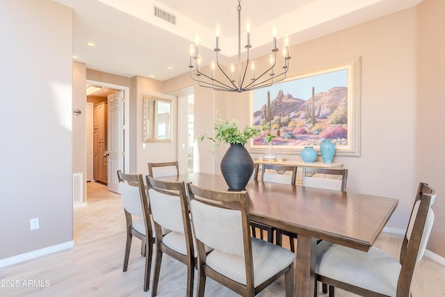 10772 E Running Deer Trl, Scottsdale, AZ 85262 - dining area with a chandelier, baseboards, light wood-style flooring, and recessed lighting