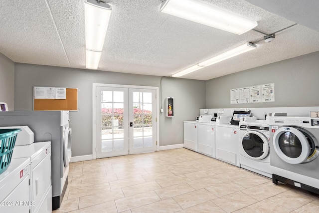 washroom with washer and dryer and french doors