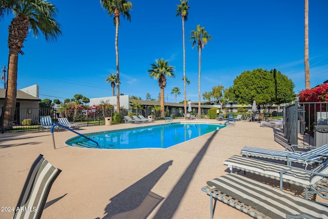 view of swimming pool featuring a patio area