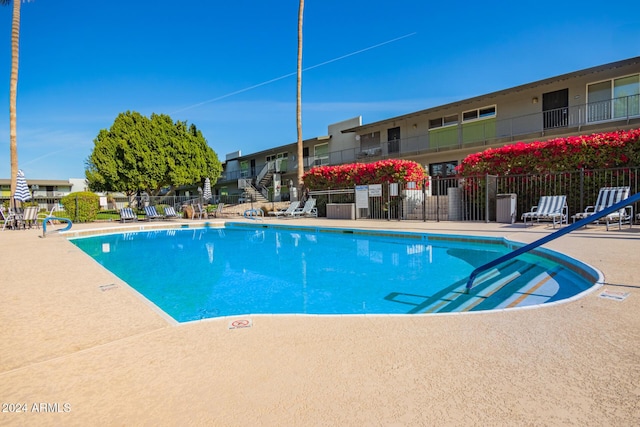 view of swimming pool with a patio area