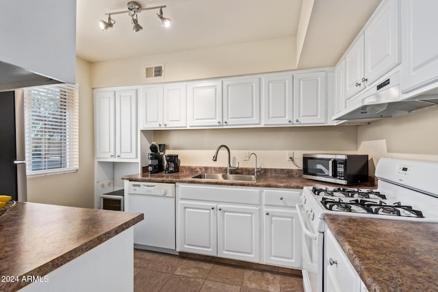 kitchen featuring white appliances, white cabinetry, and sink