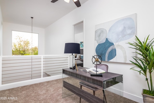 home office with ceiling fan with notable chandelier and carpet