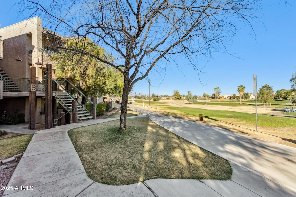 7777 E Main St Unit 228, Scottsdale, AZ 85251 - view of home's community with a yard, stairway, and view of golf course
