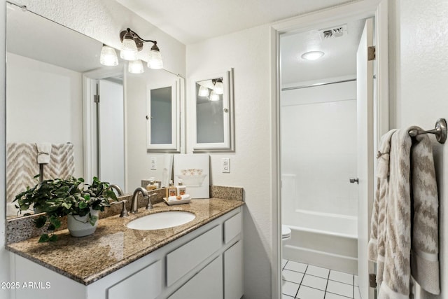 full bathroom with vanity,  shower combination, tile patterned floors, and toilet