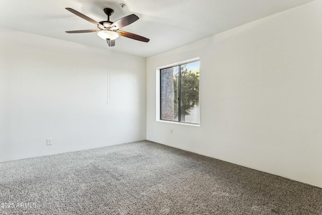 empty room featuring ceiling fan and carpet flooring