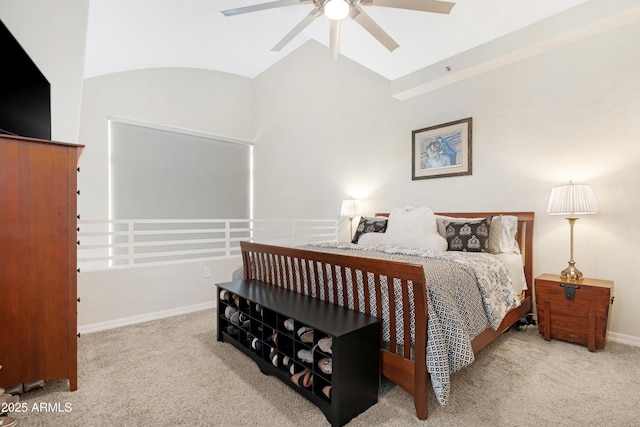 carpeted bedroom featuring lofted ceiling and ceiling fan