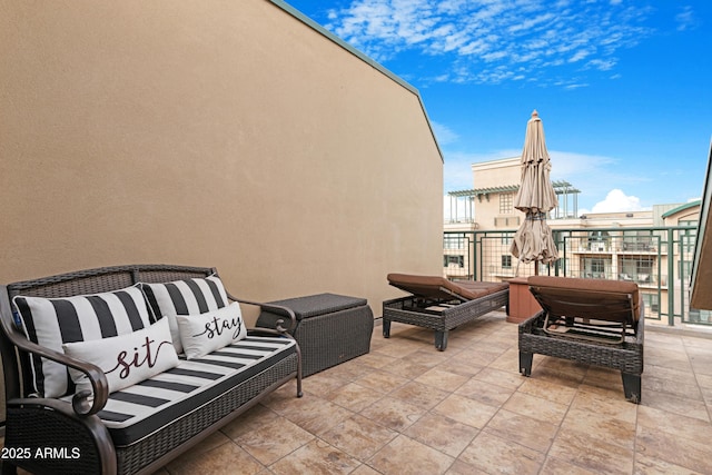 view of patio featuring outdoor lounge area and a balcony