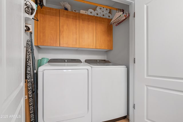 laundry area with cabinet space and washer and clothes dryer