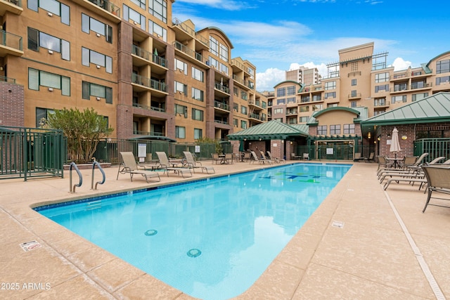 view of swimming pool with a gazebo and a patio