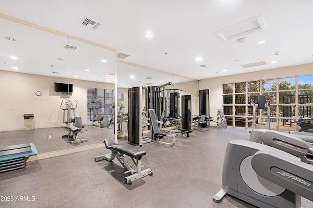 workout area featuring attic access, recessed lighting, and visible vents