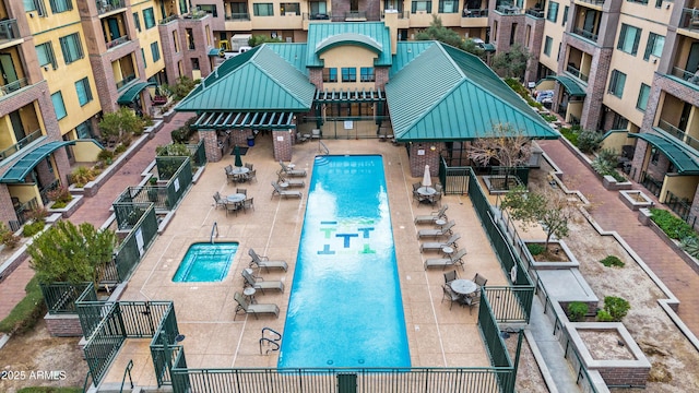 view of pool featuring a patio and fence