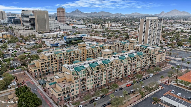 aerial view with a mountain view and a view of city