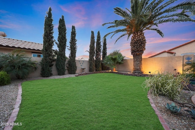 view of yard with a fenced backyard