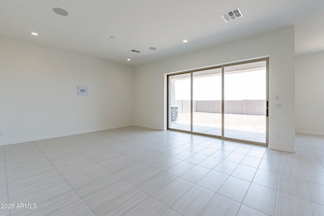 spare room with light tile patterned floors