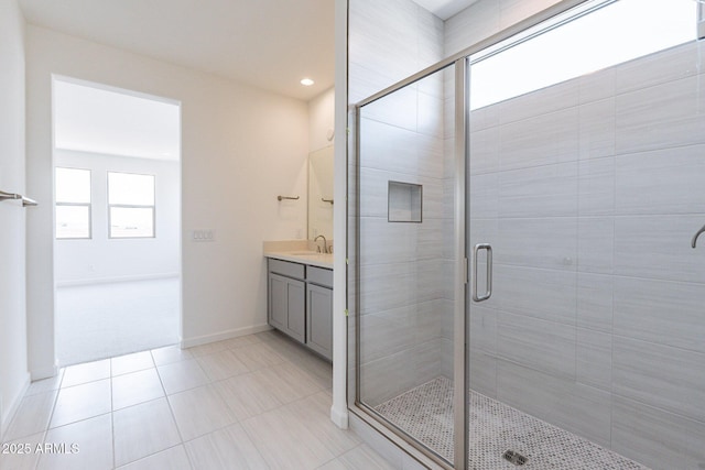 bathroom with vanity and a shower with shower door