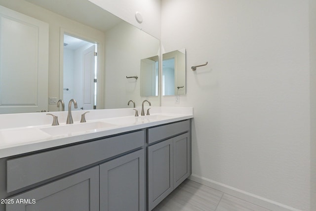 bathroom featuring tile patterned floors and vanity