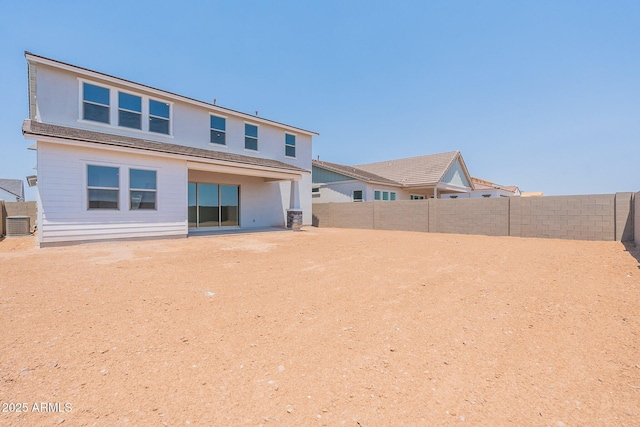 back of property featuring central air condition unit