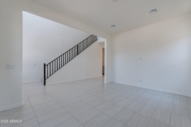 unfurnished room featuring light tile patterned floors