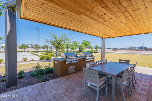 view of patio featuring area for grilling and exterior kitchen