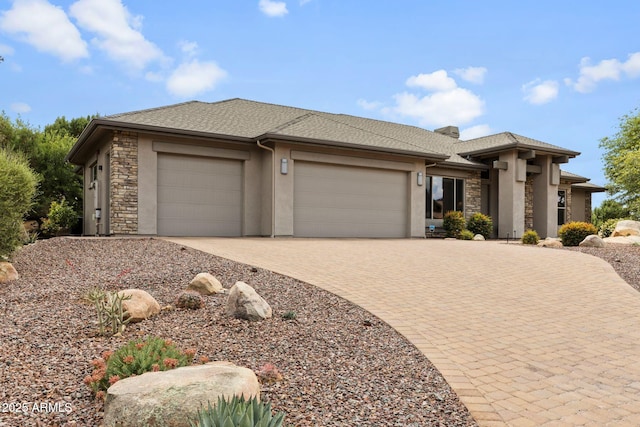 1385 Ridgewood Dr, Prescott, AZ 86305 - prairie-style home featuring stone siding, a garage, driveway, and stucco siding