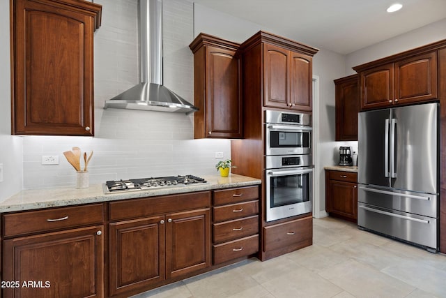 1385 Ridgewood Dr, Prescott, AZ 86305 - kitchen featuring stainless steel appliances, wall chimney exhaust hood, backsplash, light stone counters, and recessed lighting