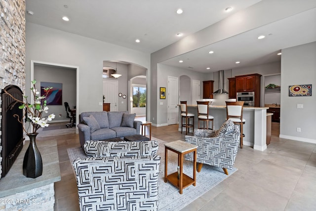 1385 Ridgewood Dr, Prescott, AZ 86305 - living room featuring arched walkways, recessed lighting, and baseboards