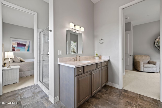 1385 Ridgewood Dr, Prescott, AZ 86305 - ensuite bathroom with vanity, a stall shower, stone finish floors, and baseboards