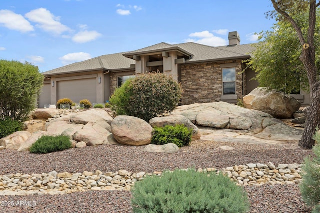 1385 Ridgewood Dr, Prescott, AZ 86305 - prairie-style house featuring a garage, a chimney, a shingled roof, and stone siding