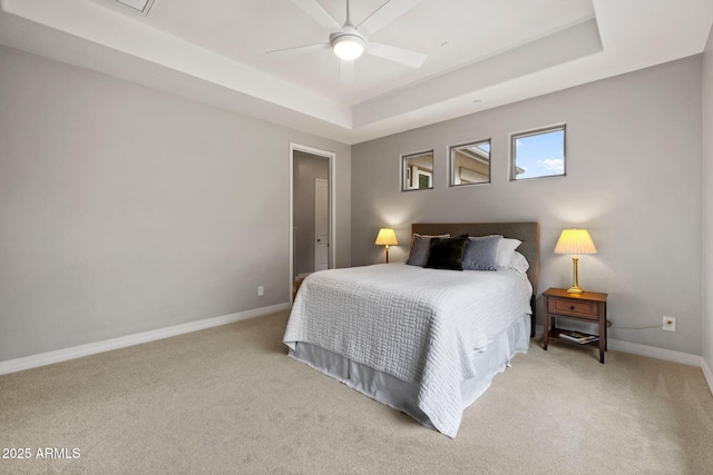 1385 Ridgewood Dr, Prescott, AZ 86305 - bedroom with light colored carpet, baseboards, a tray ceiling, and ceiling fan
