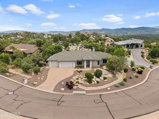 1385 Ridgewood Dr, Prescott, AZ 86305 - view of front of property featuring an attached garage, driveway, and a mountain view