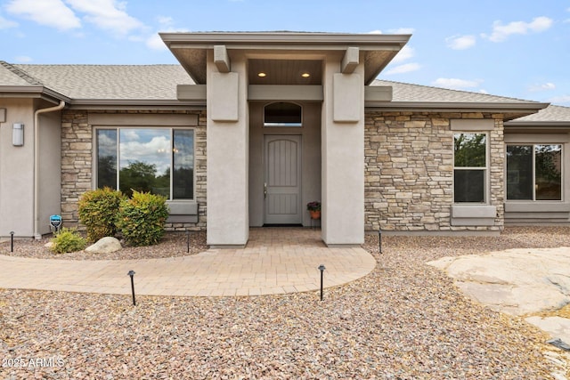 1385 Ridgewood Dr, Prescott, AZ 86305 - doorway to property with stone siding, roof with shingles, and stucco siding