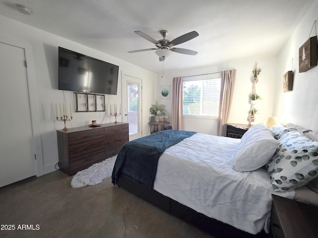 4050 E Cactus Rd Unit 107, Phoenix, AZ 85032 - bedroom featuring access to outside, ceiling fan, and concrete flooring