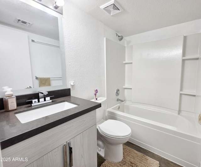 4050 E Cactus Rd Unit 107, Phoenix, AZ 85032 - bathroom featuring a textured wall, vanity, bathtub / shower combination, and a textured ceiling
