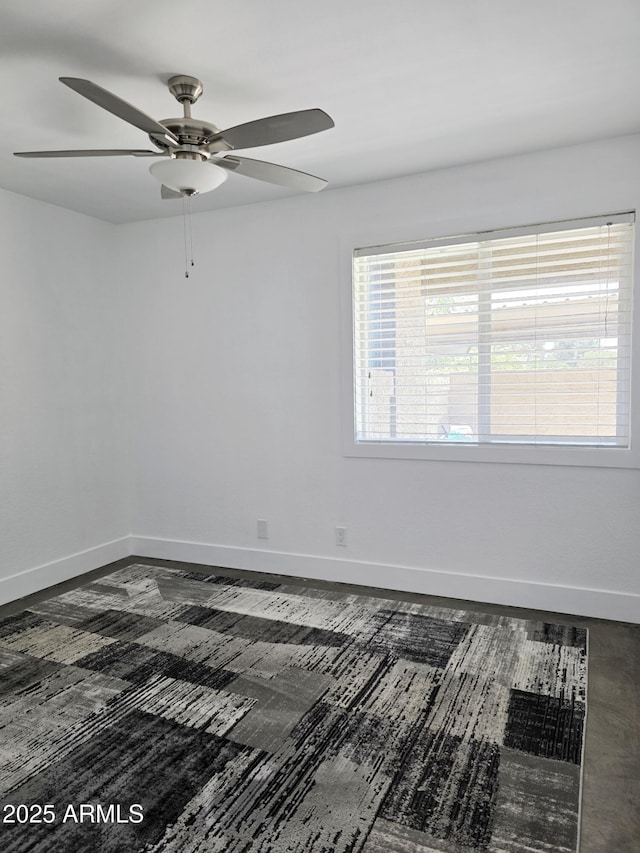 4050 E Cactus Rd Unit 107, Phoenix, AZ 85032 - spare room with a ceiling fan and baseboards