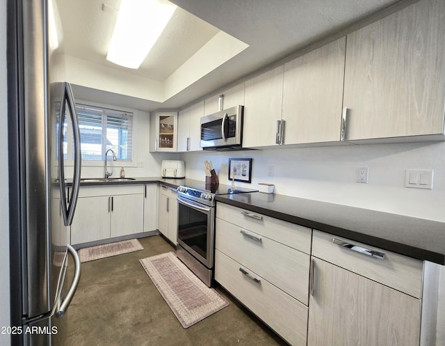 4050 E Cactus Rd Unit 107, Phoenix, AZ 85032 - kitchen featuring stainless steel appliances, dark countertops, concrete flooring, and a raised ceiling